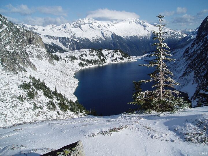 Hidden Lake, a mountain lake below forested slopes — a continuous-tone photograph